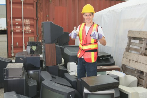 Crew sorting items for reuse during a flat clearance in Canary Wharf