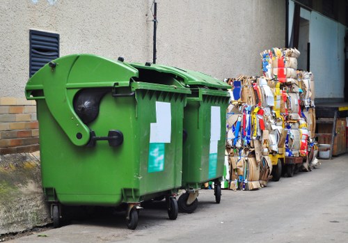Recycling bins and mixed materials separated during a Canary Wharf flat clear-out